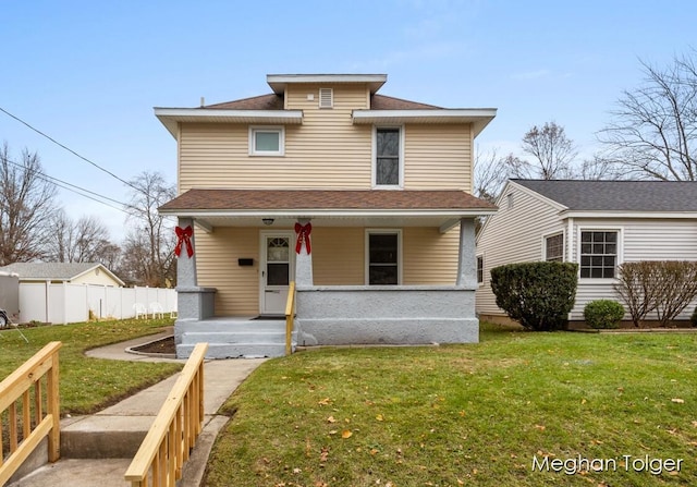 front of property with covered porch and a front lawn