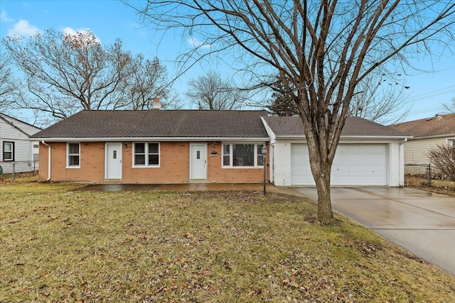 single story home featuring brick siding, a chimney, concrete driveway, a garage, and a front lawn