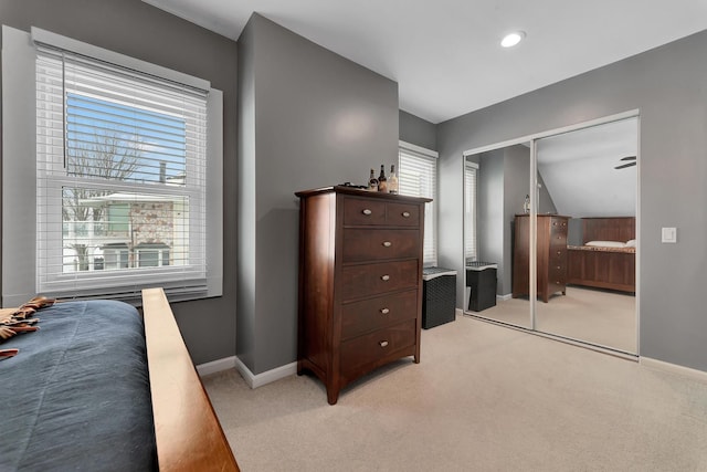 carpeted bedroom featuring a closet