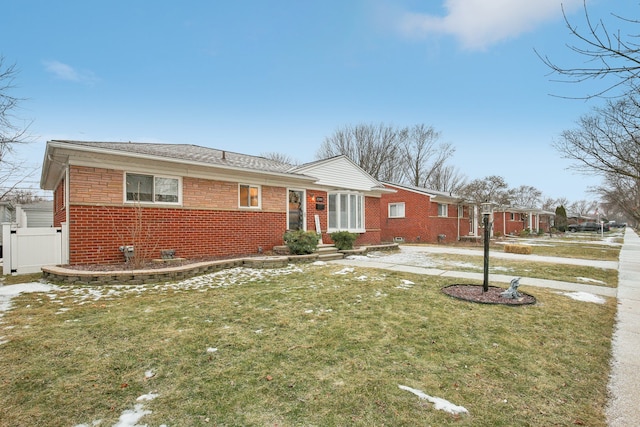 single story home with a front yard