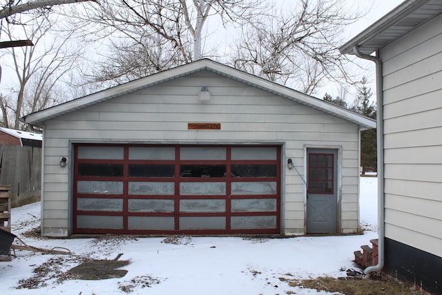 view of snow covered garage