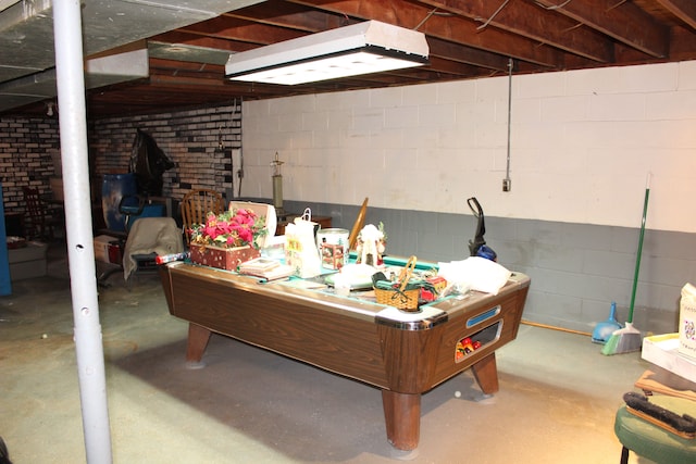 playroom with concrete flooring and pool table