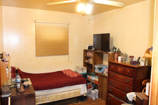 bedroom featuring hardwood / wood-style flooring and ceiling fan