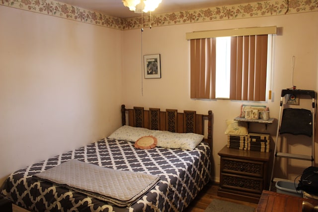 bedroom featuring dark hardwood / wood-style floors