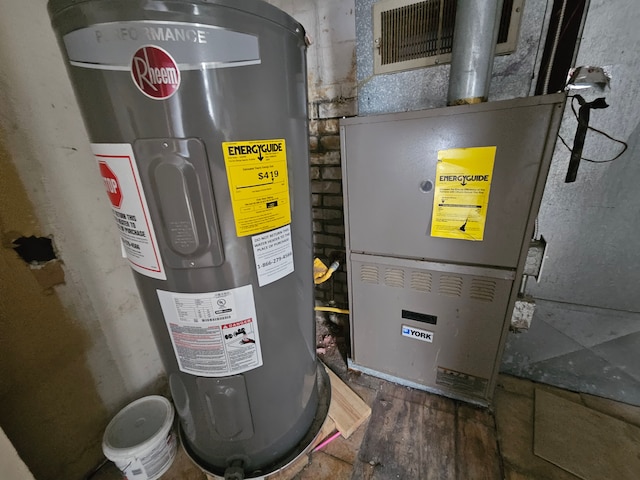 utility room with heating unit and water heater