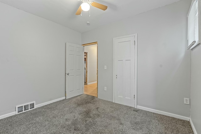 unfurnished bedroom featuring carpet floors and ceiling fan