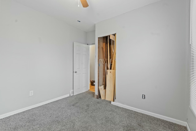 unfurnished bedroom with ceiling fan and carpet flooring