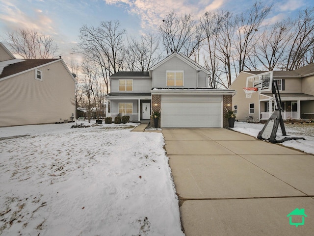 view of property with a porch and a garage