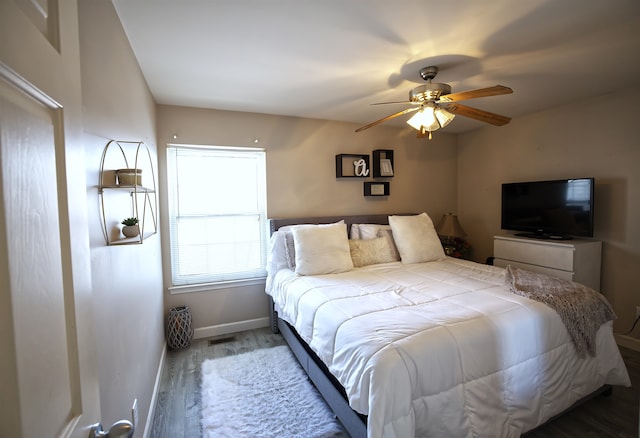 bedroom with hardwood / wood-style flooring and ceiling fan