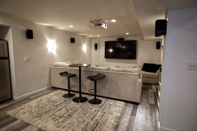 cinema room featuring dark hardwood / wood-style flooring