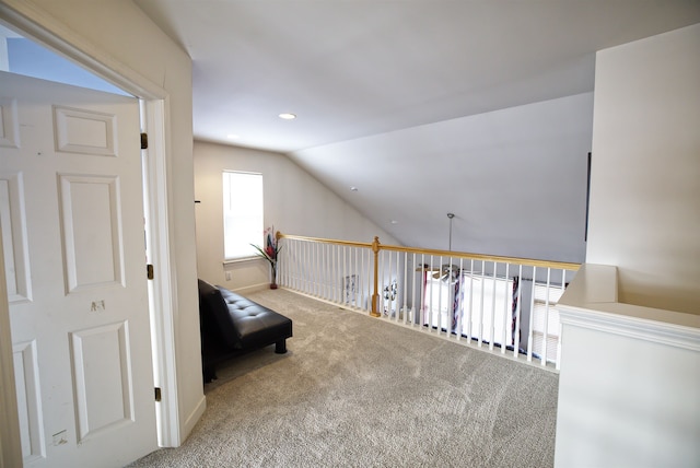 interior space with lofted ceiling and carpet floors