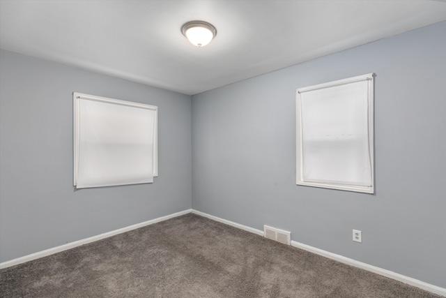 unfurnished room featuring carpet flooring