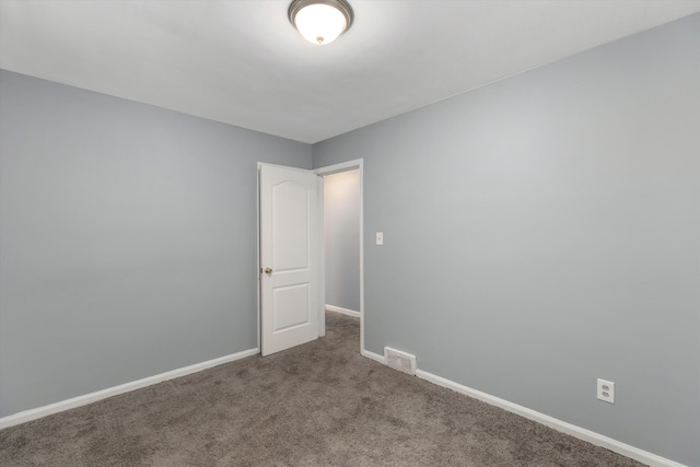 empty room featuring carpet flooring