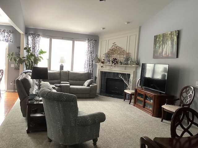 living room with a tiled fireplace