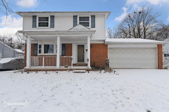 view of front property with a garage and covered porch