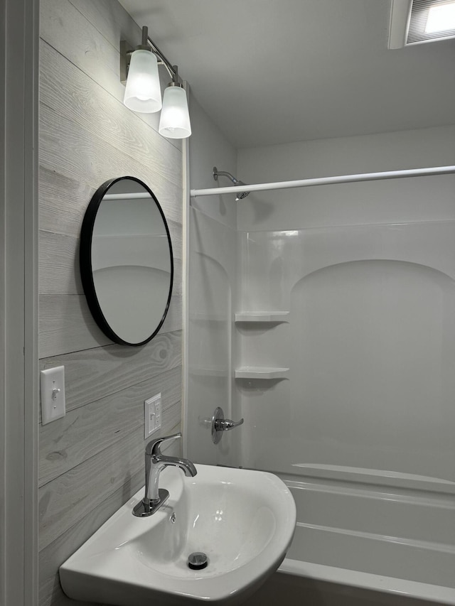 bathroom featuring a shower and sink