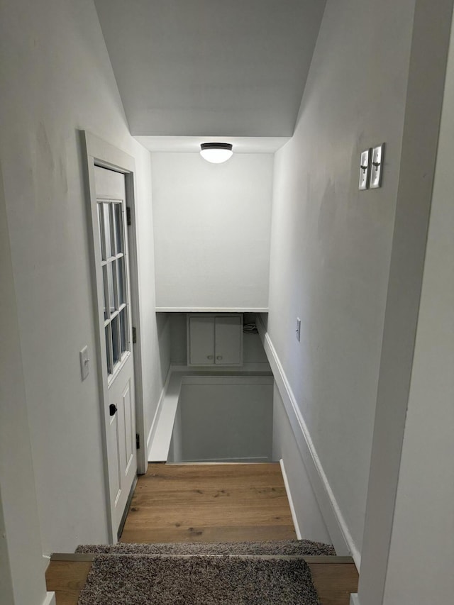 staircase featuring hardwood / wood-style flooring