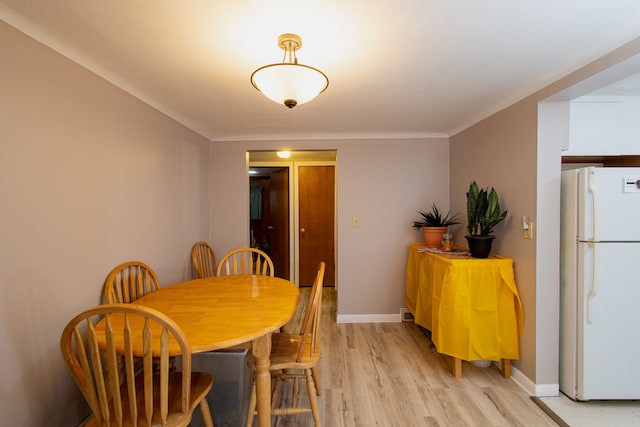 dining space with light hardwood / wood-style flooring