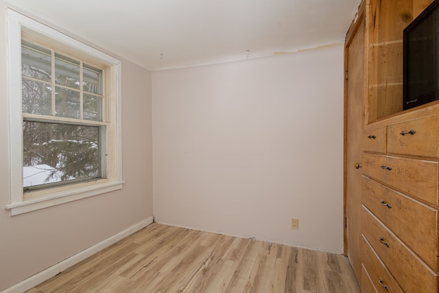 unfurnished room with light hardwood / wood-style floors