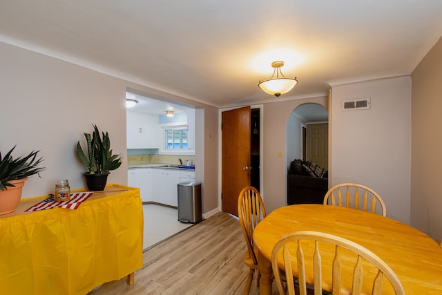 dining space featuring light wood-type flooring