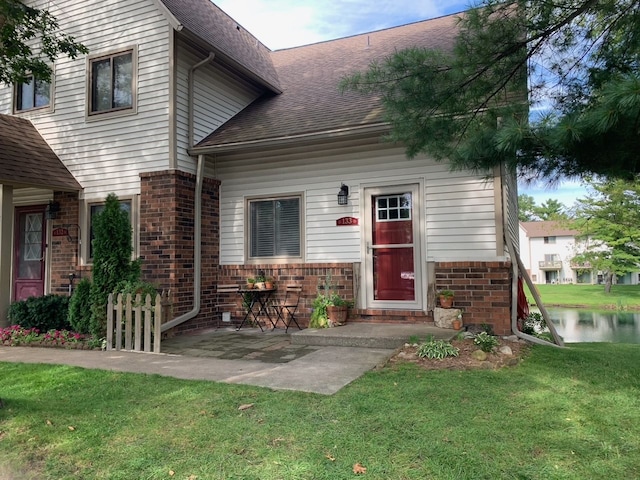 exterior space featuring a patio area and a front lawn