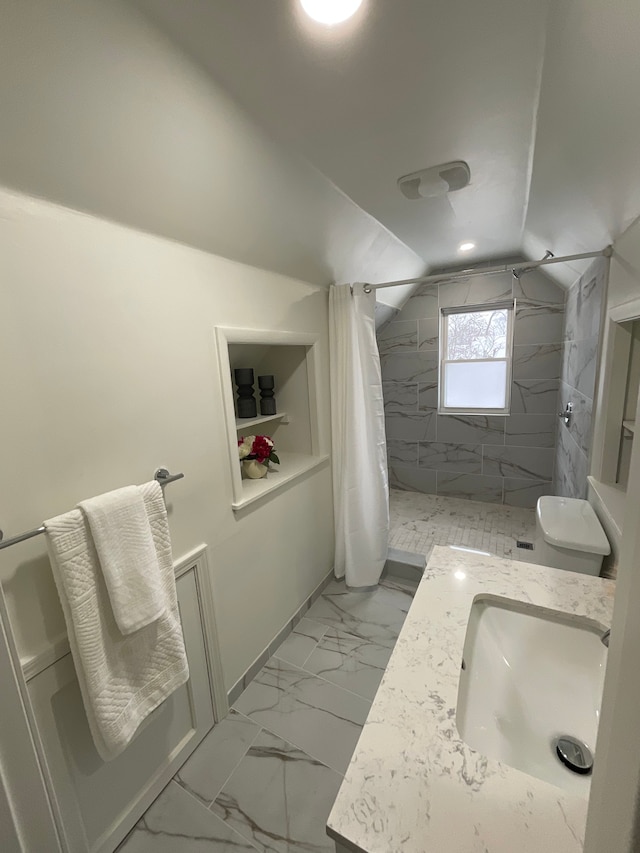 bathroom with lofted ceiling, toilet, curtained shower, and vanity