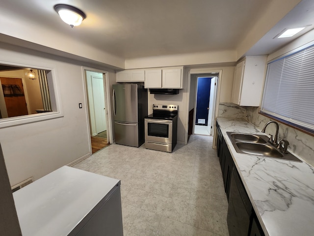 kitchen featuring a sink, stainless steel appliances, white cabinetry, exhaust hood, and tasteful backsplash