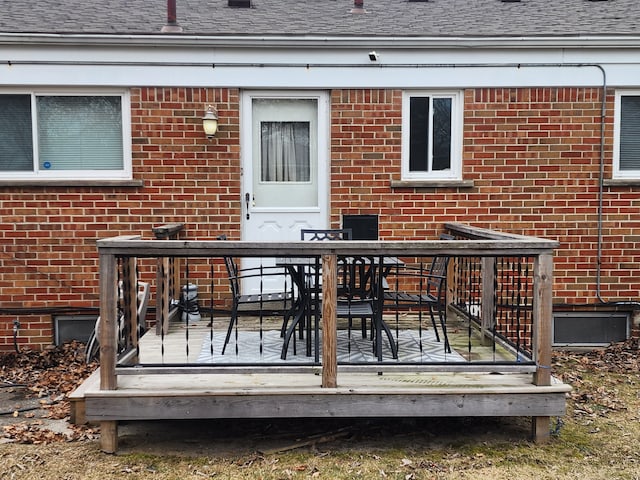 deck with outdoor dining area