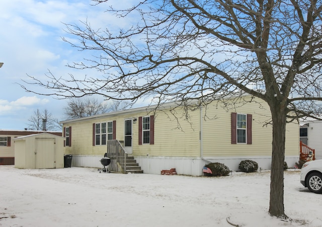 manufactured / mobile home with a shed