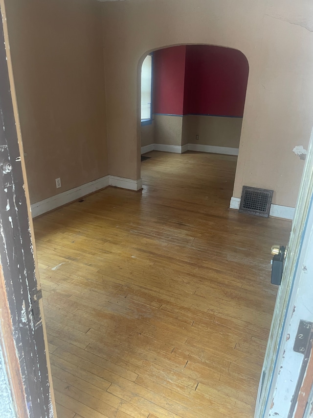 unfurnished room featuring light hardwood / wood-style flooring