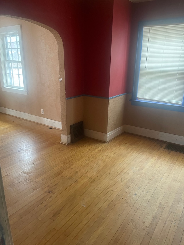 unfurnished room with light hardwood / wood-style flooring