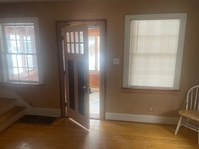 foyer with light hardwood / wood-style floors