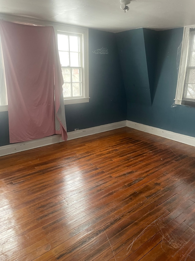 spare room featuring dark hardwood / wood-style flooring