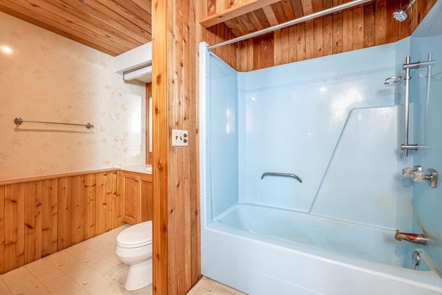 full bathroom with shower / washtub combination, vanity, toilet, wooden walls, and wood ceiling