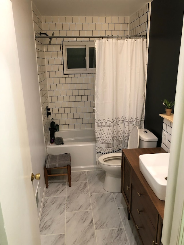 full bathroom featuring vanity, toilet, and shower / bath combo with shower curtain