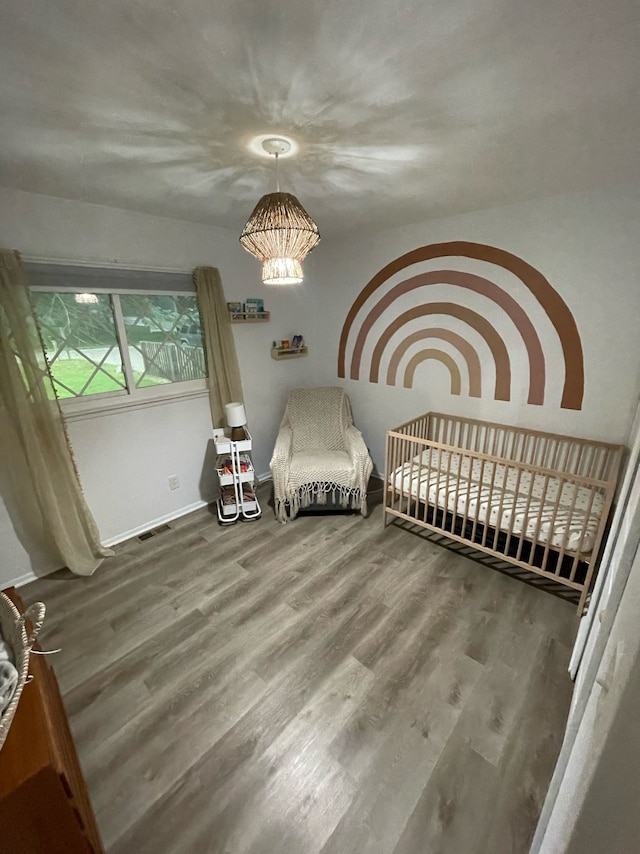 bedroom with hardwood / wood-style flooring