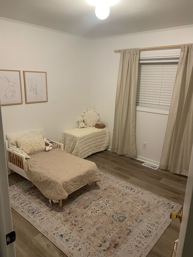 bedroom with dark wood-type flooring