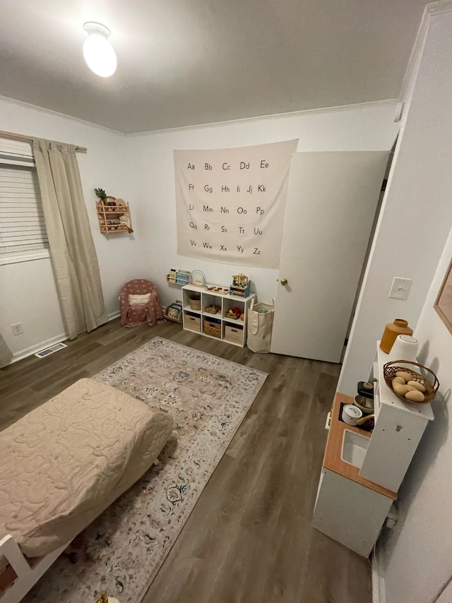 bedroom with dark wood-type flooring