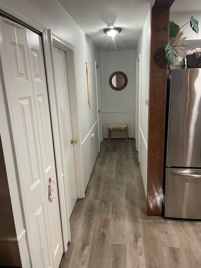 hallway with wood-type flooring