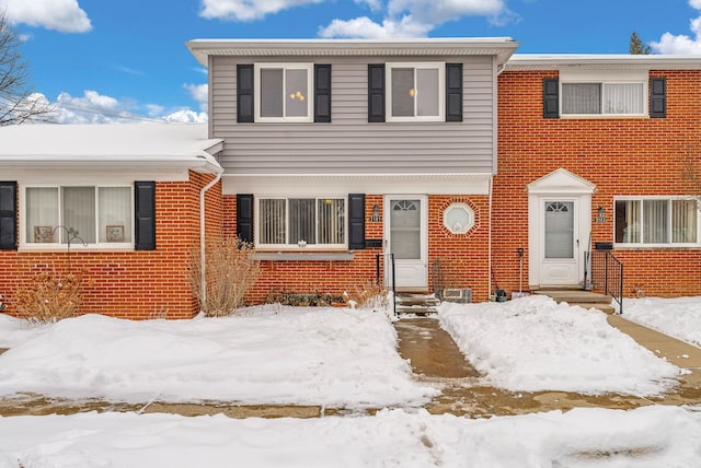 view of front of house with brick siding