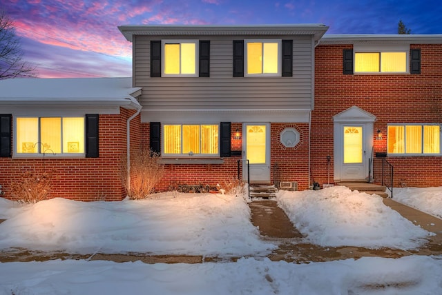 view of front of property featuring brick siding