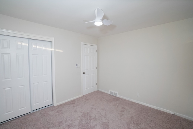 8679 Burt Rd, Detroit, MI 48228 - unfurnished bedroom with carpet, a closet, baseboards, and a ceiling fan