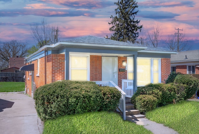 8679 Burt Rd, Detroit, MI 48228 - view of front of house featuring brick siding and a shingled roof