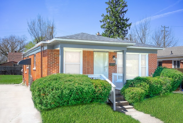 8679 Burt Rd, Detroit, MI 48228 - view of front of property with brick siding and roof with shingles
