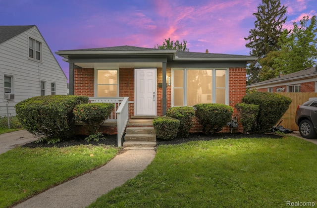 8679 Burt Rd, Detroit, MI 48228 - bungalow-style home featuring brick siding, covered porch, and cooling unit