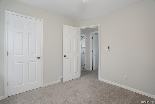 8679 Burt Rd, Detroit, MI 48228 - unfurnished bedroom featuring carpet and baseboards
