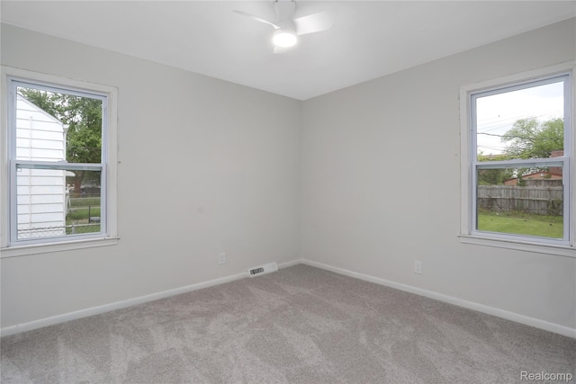8679 Burt Rd, Detroit, MI 48228 - empty room featuring carpet floors, baseboards, and ceiling fan