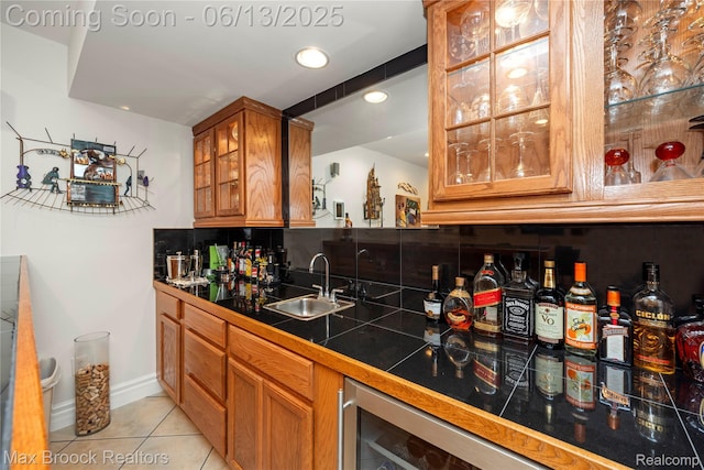 37143 Southwind Ct Unit 38, Farmington Hills, MI 48331 - indoor wet bar with light tile patterned floors, tasteful backsplash, recessed lighting, beverage cooler, and baseboards