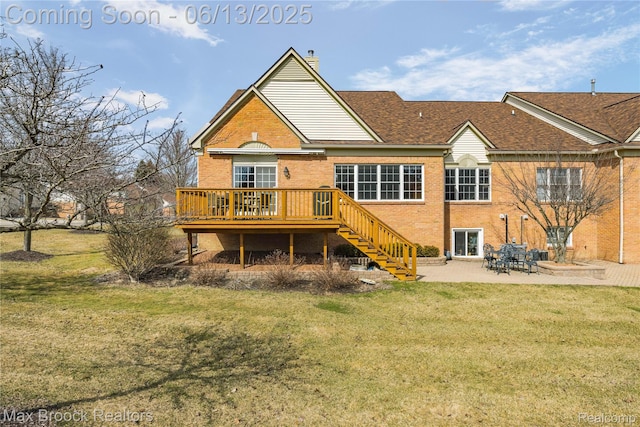 37143 Southwind Ct Unit 38, Farmington Hills, MI 48331 - rear view of house with a wooden deck, brick siding, stairway, a patio area, and a lawn
