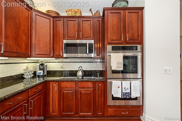37143 Southwind Ct Unit 38, Farmington Hills, MI 48331 - kitchen with appliances with stainless steel finishes, reddish brown cabinets, and backsplash